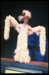 George Hearn in drag in a white costume w. a feather boa in a scene from the Broadway musical "La Cage Aux Folles." (New York)