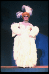 George Hearn in drag in a white costume w. a feather boa in a scene from the Broadway musical "La Cage Aux Folles." (New York)