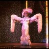 George Hearn in drag in a white costume w. a feather boa in a scene from the Broadway musical "La Cage Aux Folles." (New York)
