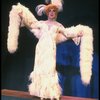 George Hearn in drag in a white costume w. a feather boa in a scene from the Broadway musical "La Cage Aux Folles." (New York)
