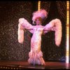 George Hearn in drag in a white costume w. a feather boa in a scene from the Broadway musical "La Cage Aux Folles." (New York)