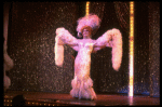 George Hearn in drag in a white costume w. a feather boa in a scene from the Broadway musical "La Cage Aux Folles." (New York)