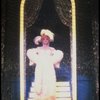 George Hearn in drag in a white costume w. a feather boa in a scene from the Broadway musical "La Cage Aux Folles." (New York)