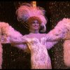 George Hearn in drag in a white costume w. a feather boa in a scene from the Broadway musical "La Cage Aux Folles." (New York)