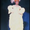 George Hearn in drag in a white costume w. a feather boa in a scene from the Broadway musical "La Cage Aux Folles." (New York)