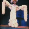George Hearn in drag in a white costume w. a feather boa in a scene from the Broadway musical "La Cage Aux Folles." (New York)
