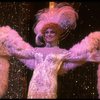 George Hearn in drag in a white costume w. a feather boa in a scene from the Broadway musical "La Cage Aux Folles." (New York)