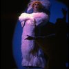 George Hearn in drag in a white costume w. a feather boa in a scene from the Broadway musical "La Cage Aux Folles." (New York)