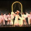 George Hearn (C) in drag in a white costume w. a feather boa in a scene from the Broadway musical "La Cage Aux Folles." (New York)