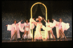 George Hearn (C) in drag in a white costume w. a feather boa in a scene from the Broadway musical "La Cage Aux Folles." (New York)