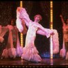 George Hearn (C) in drag in a white costume w. a feather boa in a scene from the Broadway musical "La Cage Aux Folles." (New York)