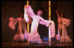 George Hearn (C) in drag in a white costume w. a feather boa in a scene from the Broadway musical "La Cage Aux Folles." (New York)