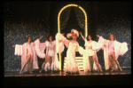 George Hearn (C) in drag in a white costume w. a feather boa in a scene from the Broadway musical "La Cage Aux Folles." (New York)
