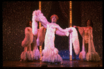 George Hearn (C) in drag in a white costume w. a feather boa in a scene from the Broadway musical "La Cage Aux Folles." (New York)