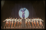 George Hearn (C, in a purple gown) on a swing in a scene from the Broadway musical "La Cage Aux Folles." (New York)