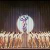 George Hearn (C, in a purple gown) on a swing in a scene from the Broadway musical "La Cage Aux Folles." (New York)