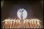 George Hearn (C, in a purple gown) on a swing in a scene from the Broadway musical "La Cage Aux Folles." (New York)