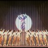 George Hearn (C, in a purple gown) on a swing in a scene from the Broadway musical "La Cage Aux Folles." (New York)
