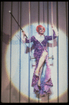 George Hearn (C, in a purple gown) on a swing in a scene from the Broadway musical "La Cage Aux Folles." (New York)