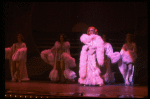 George Hearn in drag in a white costume w. a feather boa in a scene from the Broadway musical "La Cage Aux Folles." (New York)