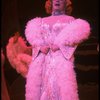 George Hearn in drag in a white costume w. a feather boa in a scene from the Broadway musical "La Cage Aux Folles." (New York)