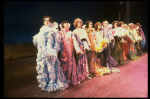 Male dancers in drag wearing hyper-ruffled costumes in a scene from the Broadway musical "La Cage Aux Folles." (New York)