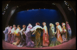 Male dancers in drag wearing hyper-ruffled costumes in a scene from the Broadway musical "La Cage Aux Folles." (New York)