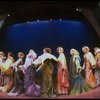 Male dancers in drag wearing hyper-ruffled costumes in a scene from the Broadway musical "La Cage Aux Folles." (New York)