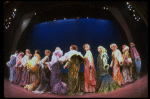 Male dancers in drag wearing hyper-ruffled costumes in a scene from the Broadway musical "La Cage Aux Folles." (New York)