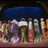 Male dancers in drag wearing hyper-ruffled costumes in a scene from the Broadway musical "La Cage Aux Folles." (New York)