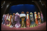 Male dancers in drag wearing hyper-ruffled costumes in a scene from the Broadway musical "La Cage Aux Folles." (New York)