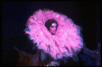 Male dancers in drag wearing hyper-ruffled costumes in a scene from the Broadway musical "La Cage Aux Folles." (New York)