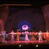 Male dancers in drag wearing hyper-ruffled costumes in a scene from the Broadway musical "La Cage Aux Folles." (New York)