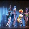 Male dancers in drag wearing bird-style costumes in a scene from the Broadway musical "La Cage Aux Folles." (New York)