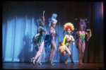 Male dancers in drag wearing bird-style costumes in a scene from the Broadway musical "La Cage Aux Folles." (New York)