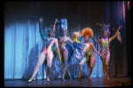 Male dancers in drag wearing bird-style costumes in a scene from the Broadway musical "La Cage Aux Folles." (New York)