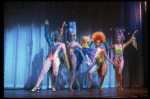 Male dancers in drag wearing bird-style costumes in a scene from the Broadway musical "La Cage Aux Folles." (New York)