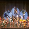Male dancers in drag wearing bird-style costumes in a scene from the Broadway musical "La Cage Aux Folles." (New York)