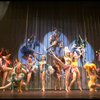 Male dancers in drag wearing bird-style costumes in a scene from the Broadway musical "La Cage Aux Folles." (New York)