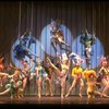 Male dancers in drag wearing bird-style costumes in a scene from the Broadway musical "La Cage Aux Folles." (New York)