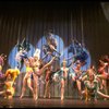 Male dancers in drag wearing bird-style costumes in a scene from the Broadway musical "La Cage Aux Folles." (New York)