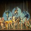 Male dancers in drag wearing bird-style costumes in a scene from the Broadway musical "La Cage Aux Folles." (New York)