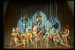 Male dancers in drag wearing bird-style costumes in a scene from the Broadway musical "La Cage Aux Folles." (New York)