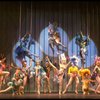 Male dancers in drag wearing bird-style costumes in a scene from the Broadway musical "La Cage Aux Folles." (New York)