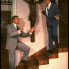 L-R) Gene Barry and George Hearn next to a huge crucifix in a scene from the Broadway musical "La Cage Aux Folles." (New York)