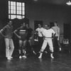 Director/choreographer Jerome Robbins (2R) working with male dancers during rehearsal of the Broadway production of the musical "West Side Story".