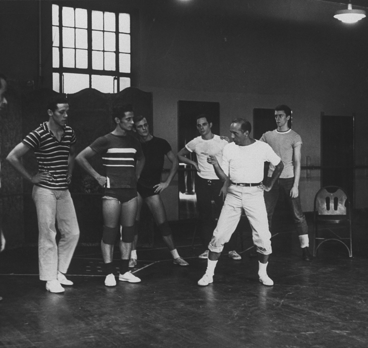 Director/choreographer Jerome Robbins (2R) working with male dancers ...