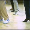 Legs of co-choreographer and director Michael Bennett (C) working w. cast during rehearsal for the Broadway musical "Dreamgirls." (New York)