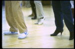Legs of co-choreographer and director Michael Bennett (C) working w. cast during rehearsal for the Broadway musical "Dreamgirls." (New York)
