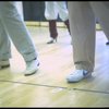 Legs of co-choreographer and director Michael Bennett (C) working w. cast during rehearsal for the Broadway musical "Dreamgirls." (New York)
